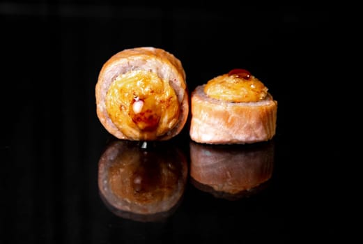 rolls with reflection on black background, photo for menu design