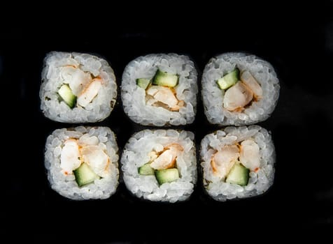 Photo for the menu. japanese rolls with cucumber top view.