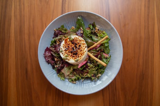 salad with herbs, cheese and seeds. healthy food