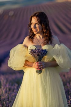 Woman lavender field. happy woman in yellow dress in lavender field summer time at sunset. Aromatherapy concept, lavender oil, photo session in lavender.