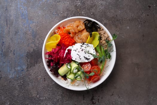 A delicious and healthy seafood rice bowl filled with fresh vegetables, egg, and tasty dressing. Perfect for a quick and easy meal.