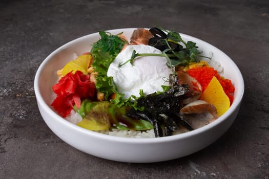 A delicious and healthy poke bowl filled with fresh salmon, a soft-boiled egg, and an assortment of colorful vegetables.