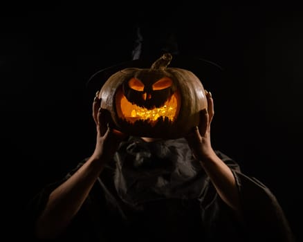 Pumpkin jack o lantern instead of a woman's head. Halloween.