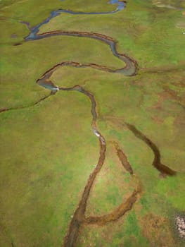 The meander in Antalya Sobucimen plateau. Aerial view of complex waterways weaving  through lush green fields