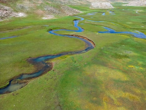 The meander in Antalya Sobucimen plateau. Aerial view of complex waterways weaving  through lush green fields