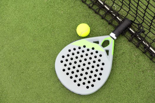 Paddle tennis objects on grass court. High quality photo