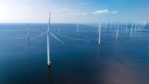 A vast expanse of wind turbines scattered across the ocean, their blades turning gracefully in the breeze, harnessing renewable energy. windmill turbines at sea in the Netherlands