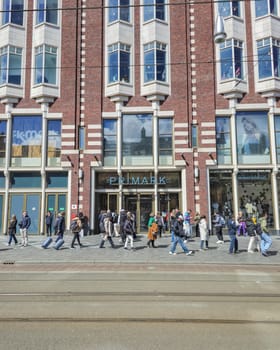 Amsterdam Netherlands 21 April 2024, people walking shopping at the Primark shopping mall on a Spring day