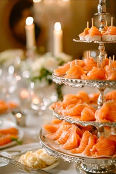A silver platter with three tiers of salmon and a white tablecloth. The table is set for a special occasion. Generative AI