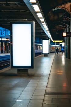 A train station with two large white billboards. Generative AI