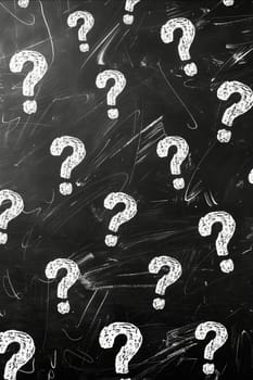 A chalkboard with many white question marks drawn on it. Generative AI
