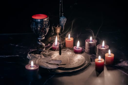 Mysterious Occult Ceremony with Pendulum and Mystic Symbols