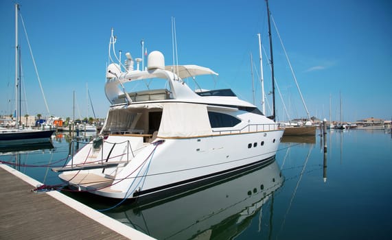 Luxury yacht mooring in a harbour.