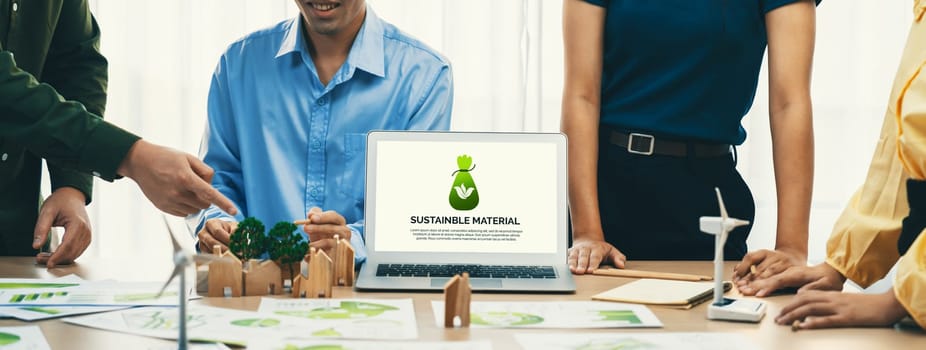 Sustainable material illustration displayed on laptop during green business meeting. ESG environment social governance and Eco conservative concept. Front view. Closeup. Delineation.