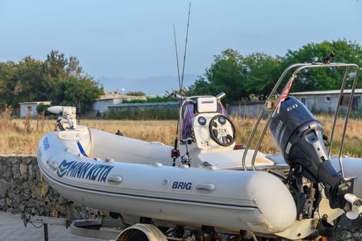 Gaziveren Cyprus - 04.24.2024 white fishing rubber boat on trailer 4