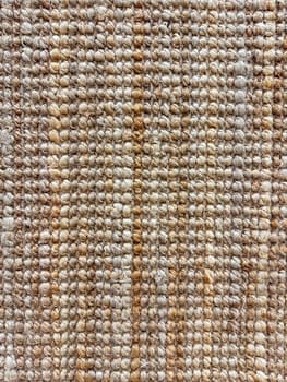 Macro shot of textured jute rug with natural beige and brown tones for interior design and home decor. High quality photo