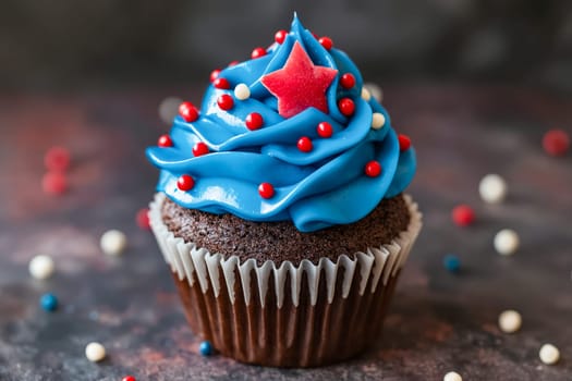 A blue cupcake with red and white sprinkles on top and a star in the middle. The cupcake is decorated for the Fourth of July. Generative AI