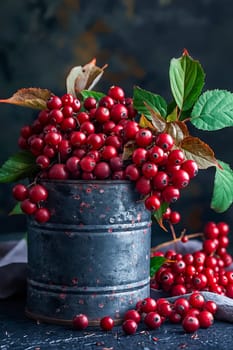 A can of berries is sitting on a table with a leafy green stem. The berries are red and appear to be fresh. Generative AI