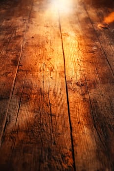 A wooden floor with a sunbeam shining on it. The floor is made of wood and has a natural, rustic look. Generative AI