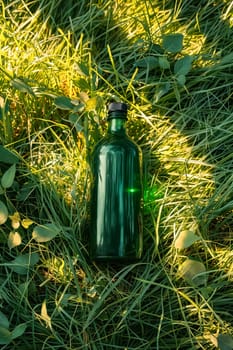 A green bottle is sitting on the grass. The bottle is green and has a black cap. Generative AI