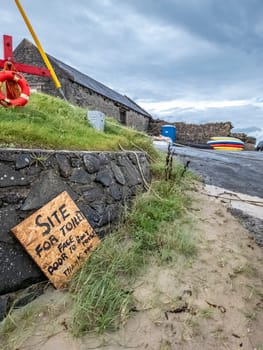 Sign explaining where to find the toilet at Portnoo harbour - County Donegal, Ireland