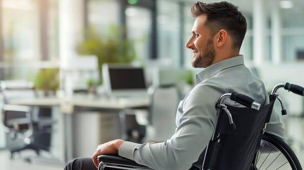Confident disabled employee man sitting in a wheelchair working at workplace in modern office
