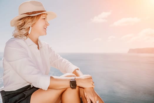 Happy girl doing yoga with laptop working at the beach. beautiful and calm business woman sitting with a laptop in a summer cafe in the lotus position meditating and relaxing. freelance girl remote work beach paradise