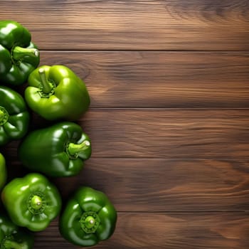 Banner: Green bell pepper on wooden background. Top view with copy space.