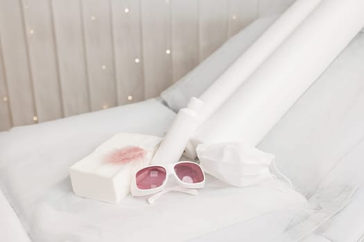 Protective glasses, UV protection of cosmetologist. Body hair laser hair removal. The concept of beauty, depilation, waxing, sugaring smooth skin without hair, health.