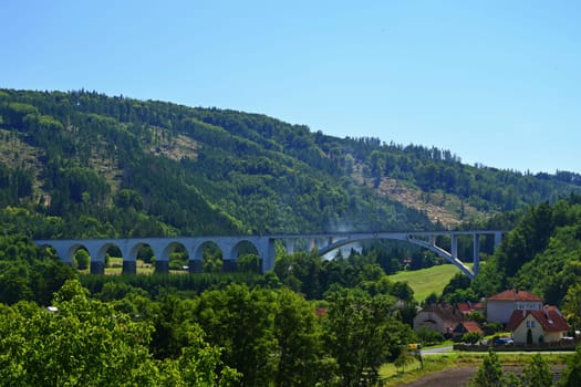 Big railway bridge in the valley. Dolni Loucky - Czech Republic. Concept for transport and travel by train.
