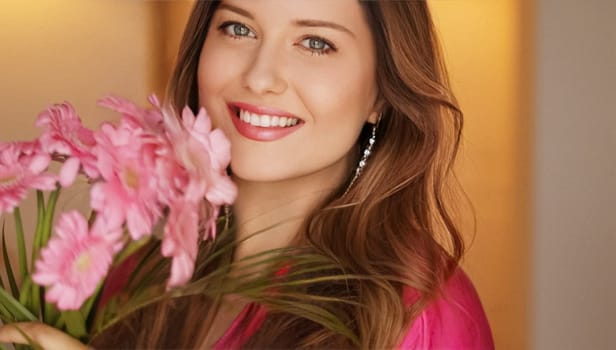 Happy smiling woman with bouquet of pink flowers as holiday gift, beauty blogger concept