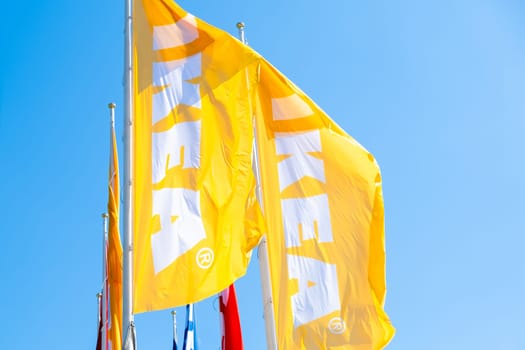 PRAGUE, CZECHIA -APRIL, 2024: Yellow IKEA flags against blue sky.