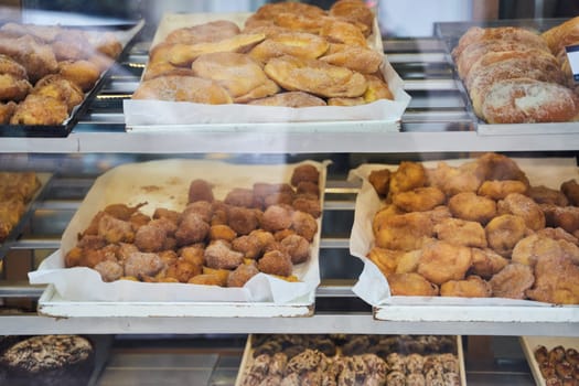 A wide selection of baked goods, including pastries, are showcased in the bakery. Each item is made with fresh ingredients and skillful baking techniques