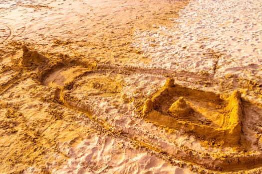 Temple of sand on the beach like a sandcastle in Bentota Beach in Sri Lanka.