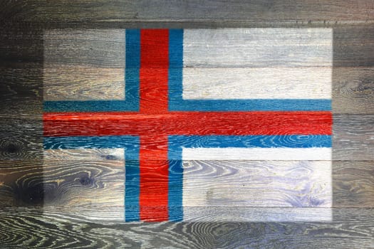 A Faroe islands flag on rustic old wood surface background