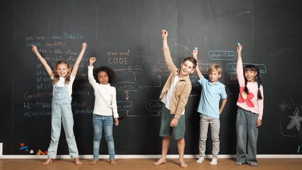 Diverse student raised hands up while standing at blackboard written with engineering prompt or coding, programing system code. Showing comment, asking questions, volunteering, voting. Erudition.