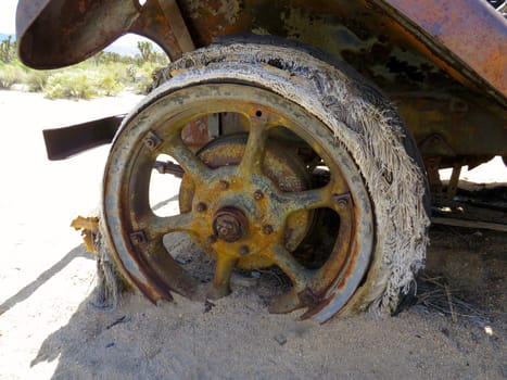 Frayed Decaying Antique Car Tire on Old Vehicle Rusting in California Desert. High quality photo