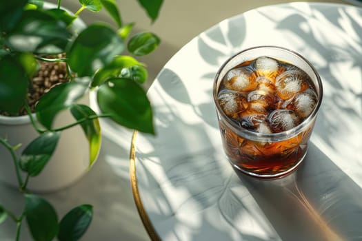 A glass of iced black coffee on white background with plant and clean composition, Minimal style.