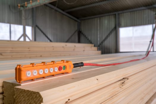 Image of remote control for crane loading timber, close-up