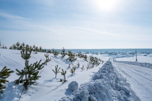 Image of road to village in wintertime. Russia