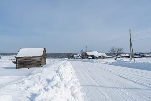 Winter time. Image of Russian village covered with snow