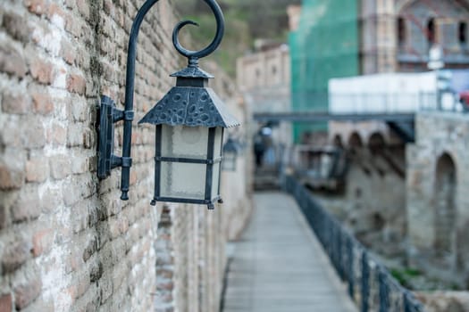 Close-up of lantern on brick wall. Tbilisi, Georgia