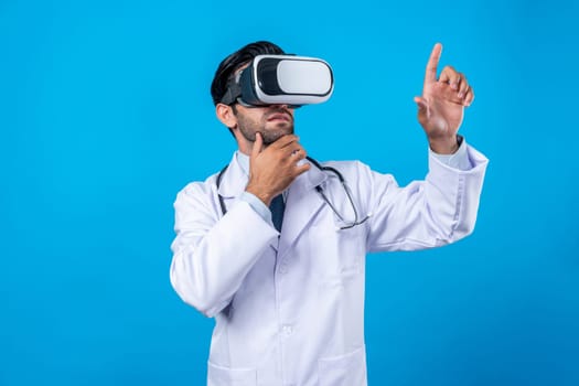 Caucasian doctor making decision and thinking about medical data. Professional doctor enter in metaverse and virtual reality world while wearing lab coat and VR glasses. Innovation concept. Deviation.