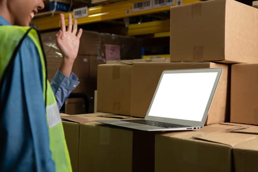 Computer with green screen display in warehouse storage room . Delivery and transportation software concept .