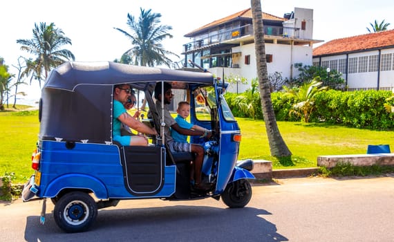 Bentota Beach Southern Province Sri Lanka 16. March 2018 Driving a blue Rickshaw Tuk Tuk cab vehicle in Bentota Beach Galle District Southern Province Sri Lanka.