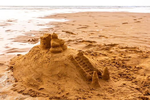 Temple of sand on the beach like a sandcastle in Bentota Beach in Sri Lanka.