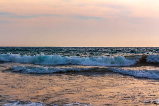 Beautiful sunny landscape panorama with huge powerful waves and clear water in Bentota Beach Galle District Southern Province Sri Lanka island.