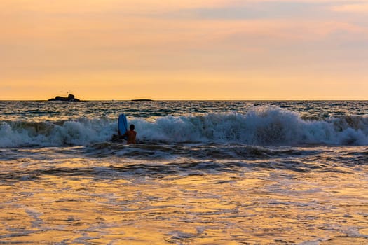 Beautiful sunny landscape panorama with huge powerful waves and clear water in Bentota Beach Galle District Southern Province Sri Lanka island.