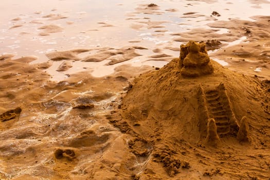 Temple of sand on the beach like a sandcastle in Bentota Beach in Sri Lanka.
