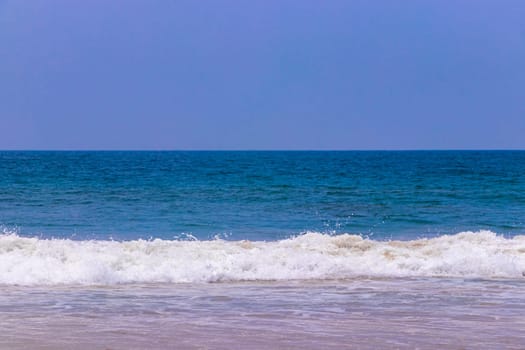 Beautiful sunny landscape panorama with huge powerful waves and clear water in Bentota Beach Galle District Southern Province Sri Lanka island.